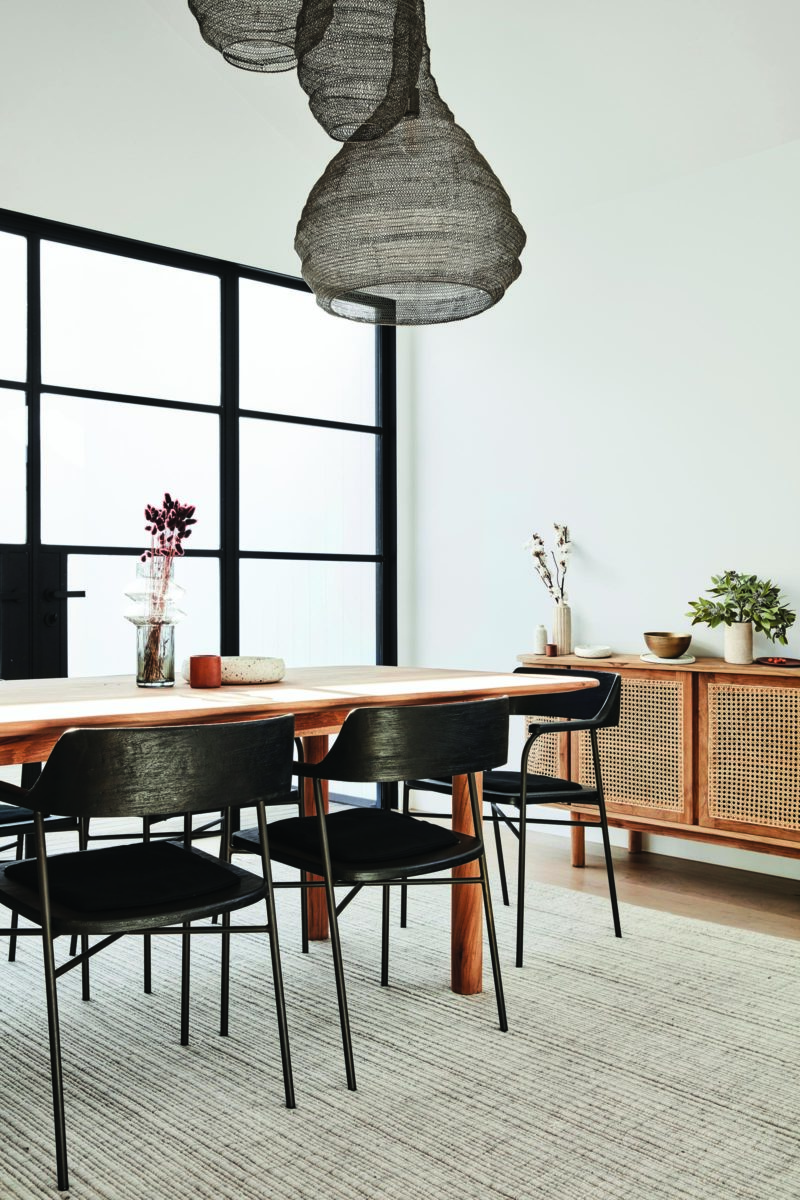 globwest-2020-interior-design-trends-timber-dining-table-with-black-timber-dining-chairs-and-sideboard-with-mesh-front